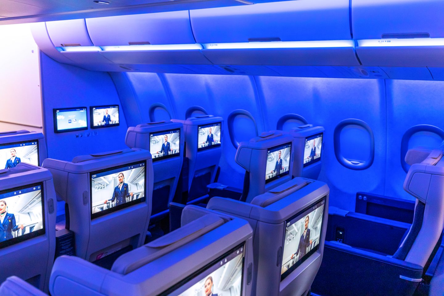 Premium Economy seats with the TV headrests turned on.