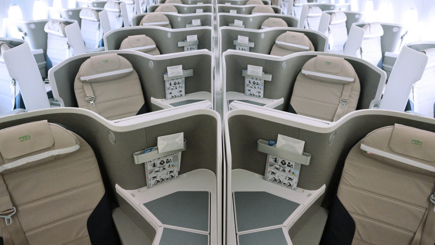 An overhead view of a Business Class cabin facing the seats. 