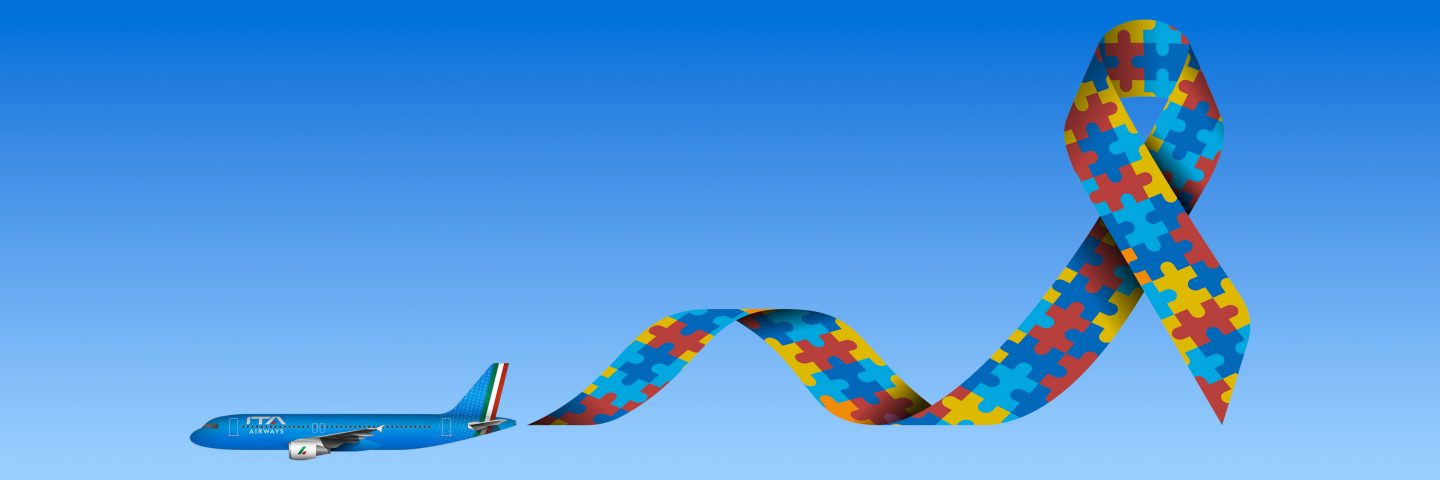 An aircraft in flight followed by a colorful ribbon with a puzzle pattern.