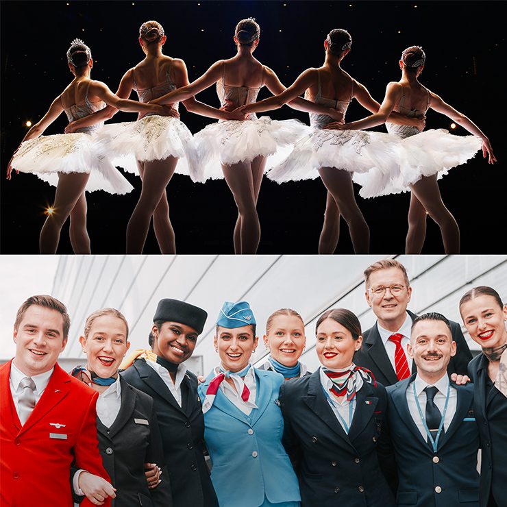 Fünf Balletttänzerinnen von hinten auf der Bühne und eine Gruppe von Flugbesatzungsmitgliedern in Uniform.