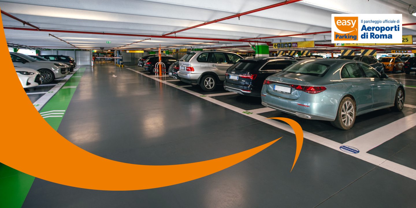 Un parking couvert avec des voitures garées ; le logo easy Parking est visible dans le coin supérieur droit.