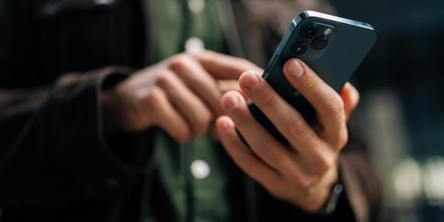 Close-up of a person using a smartphone.