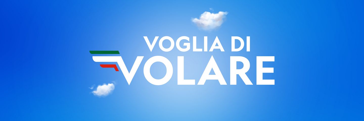 The text 'Voglia di volare' on a blue background with clouds and the ITA Airways logo.