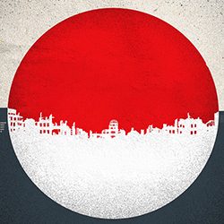 Grande círculo vermelho e branco mostra o horizonte de uma cidade em ruínas.