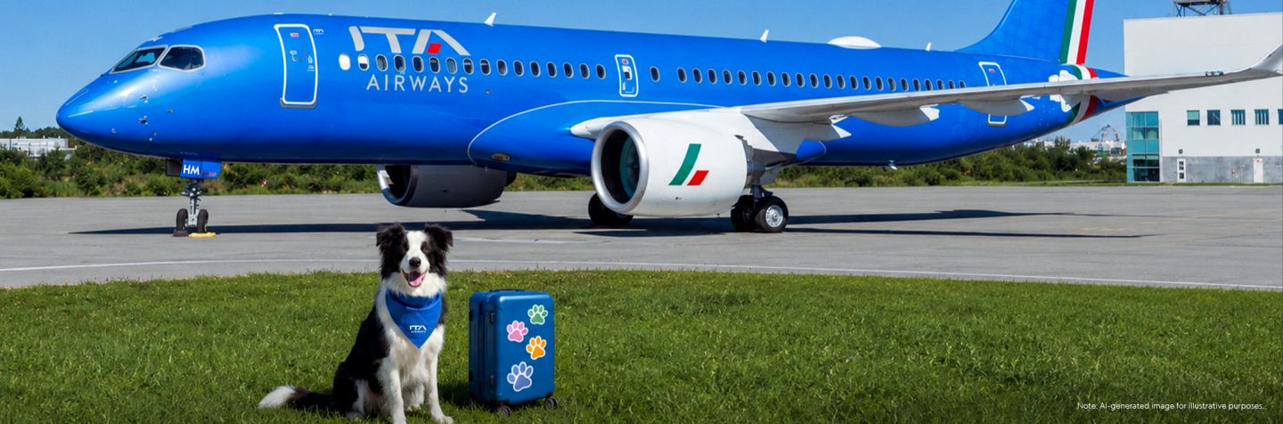 A border collie with a blue bandanna sits next to a suitcase in front of an ITA Airways aircraft.