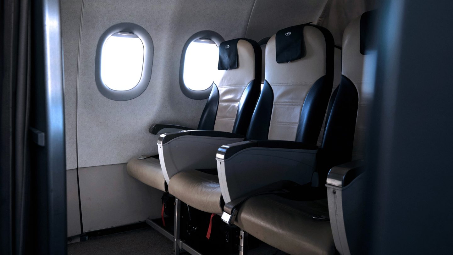 Empty Business Class seats inside the aircraft cabin.