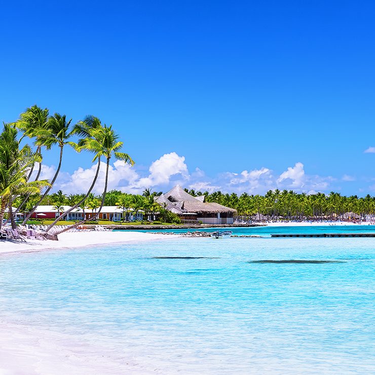 Beach in Santo Domingo with white sand, crystal-clear waters and palm trees
